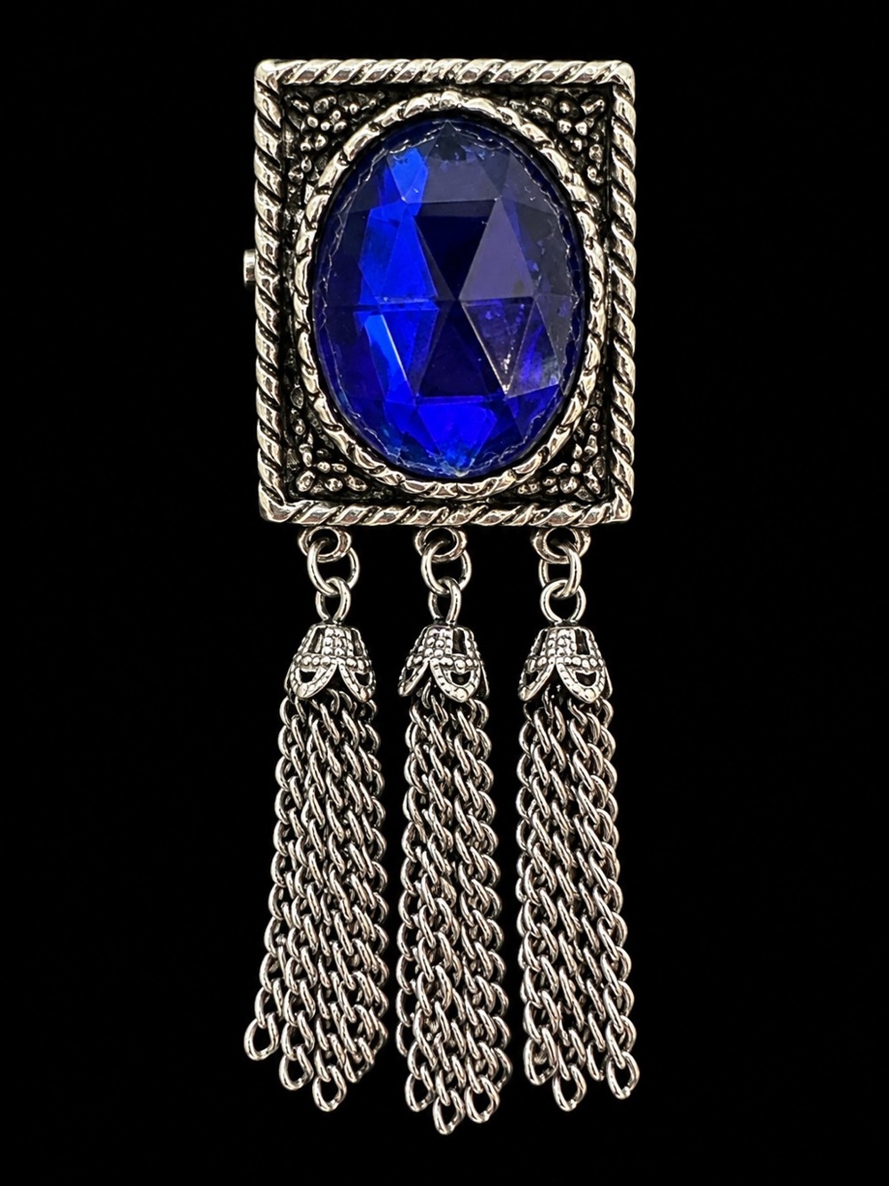 Silver Tassel Brooch with Deep Blue Faceted Stone